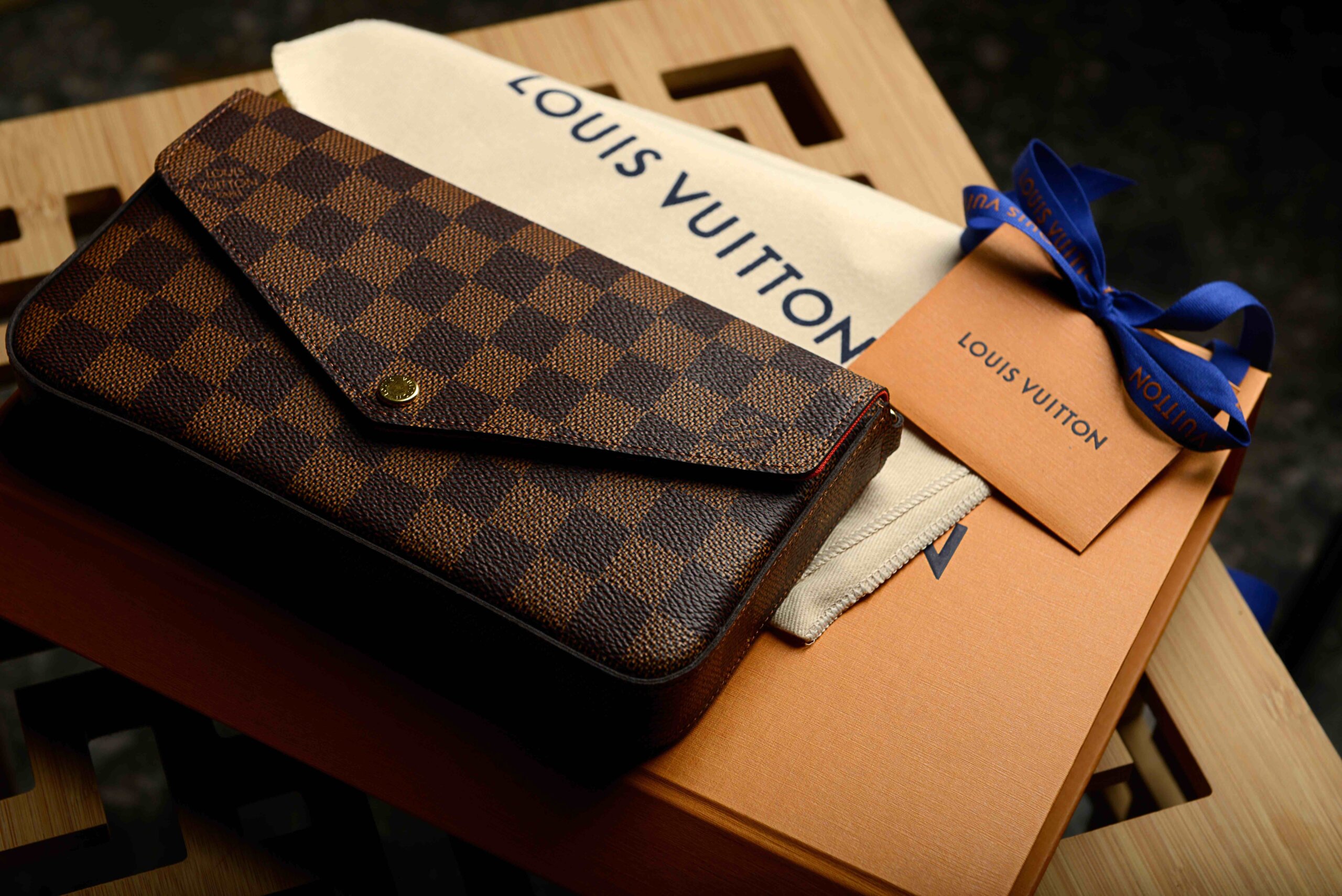Creating a distinct visual language to share your brand story - Louis Vuitton brown woman hand bag.